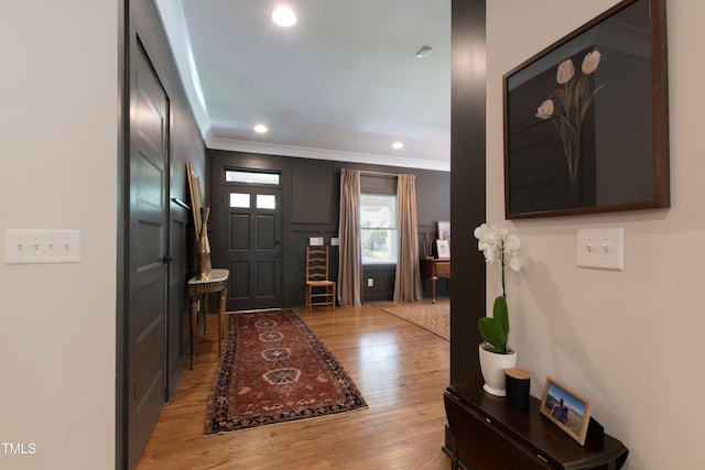 2517 Medway Dr, Raleigh, NC 27608 - foyer featuring recessed lighting, ornamental molding, and light wood finished floors