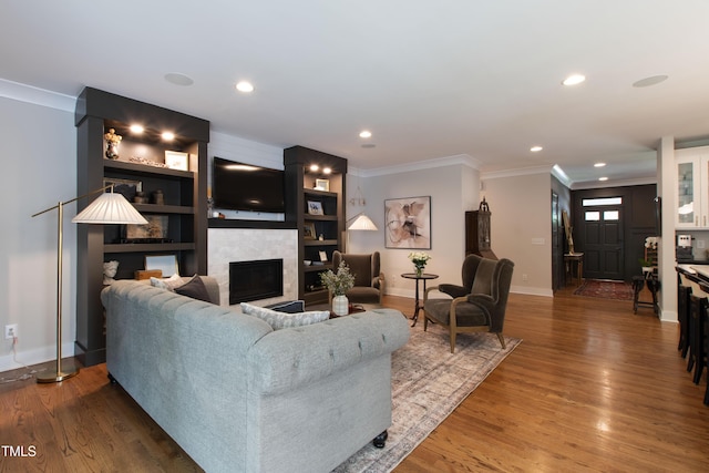 2517 Medway Dr, Raleigh, NC 27608 - living room featuring a large fireplace, baseboards, recessed lighting, and ornamental molding