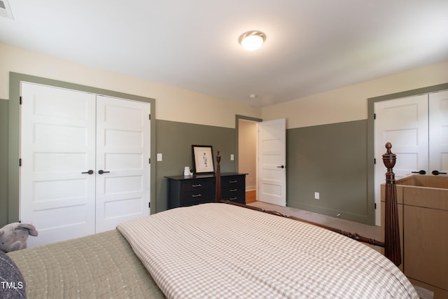 2517 Medway Dr, Raleigh, NC 27608 - bedroom with carpet floors, visible vents, and a closet