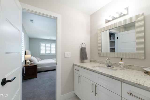 2517 Medway Dr, Raleigh, NC 27608 - bathroom with vanity, baseboards, and visible vents