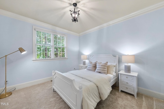 carpeted bedroom with crown molding and baseboards