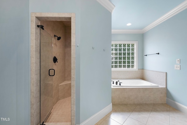 bathroom with a shower stall, ornamental molding, tile patterned floors, baseboards, and a garden tub