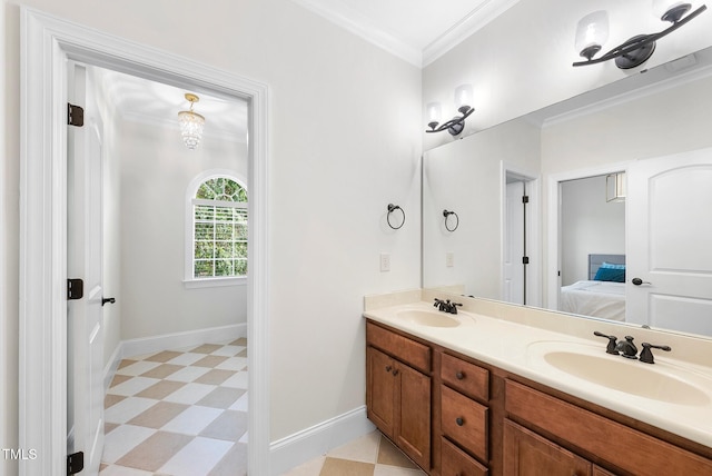 bathroom featuring tile patterned floors, double vanity, baseboards, crown molding, and connected bathroom