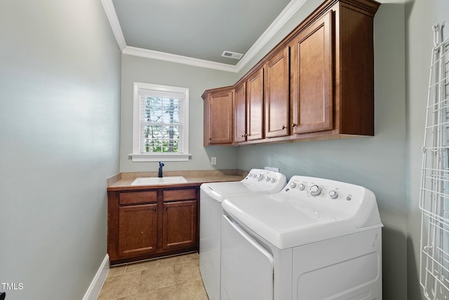 laundry room with cabinet space, separate washer and dryer, ornamental molding, and baseboards