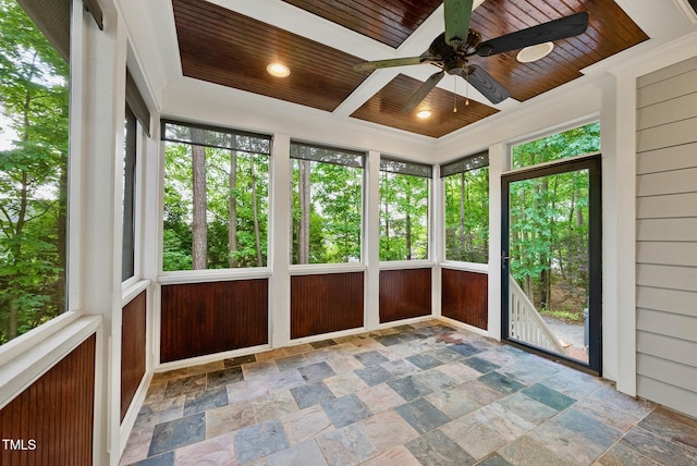 unfurnished sunroom with wooden ceiling and stone finish floors