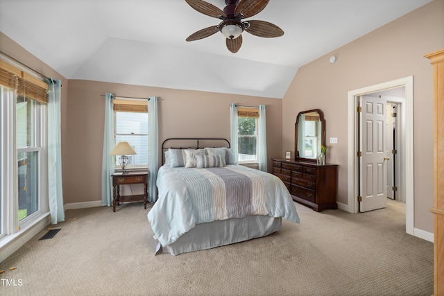 bedroom with visible vents, lofted ceiling, light carpet, baseboards, and a ceiling fan