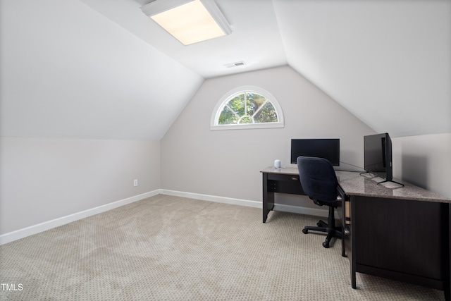 office area with carpet flooring, baseboards, visible vents, and lofted ceiling