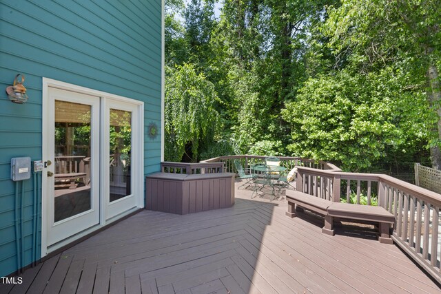 wooden terrace with outdoor dining space