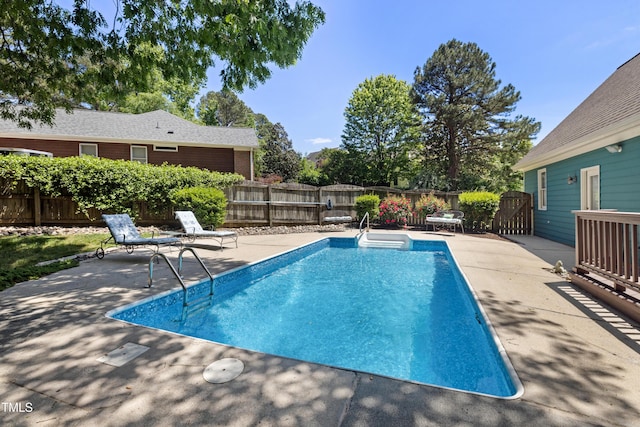 view of pool with a fenced in pool, a fenced backyard, and a patio area