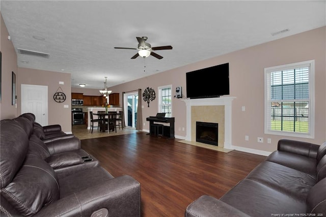 4258 Cherry Hill Ln, Fayetteville, NC 28312 - living area with visible vents, dark wood finished floors, ceiling fan with notable chandelier, and baseboards