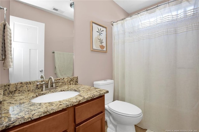 4258 Cherry Hill Ln, Fayetteville, NC 28312 - bathroom featuring toilet, visible vents, and vanity