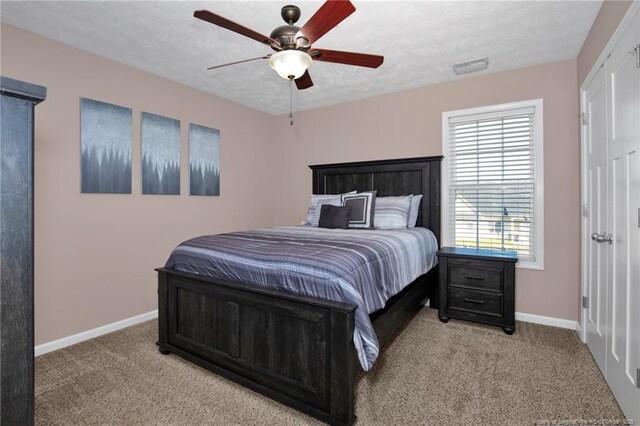 4258 Cherry Hill Ln, Fayetteville, NC 28312 - bedroom featuring ceiling fan, a textured ceiling, visible vents, light colored carpet, and baseboards