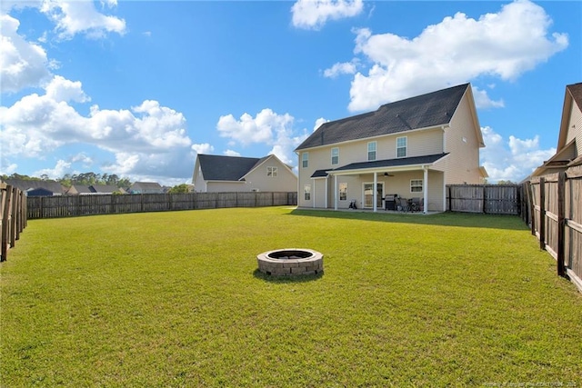 4258 Cherry Hill Ln, Fayetteville, NC 28312 - view of yard with a fenced backyard, ceiling fan, an outdoor fire pit, and a patio area