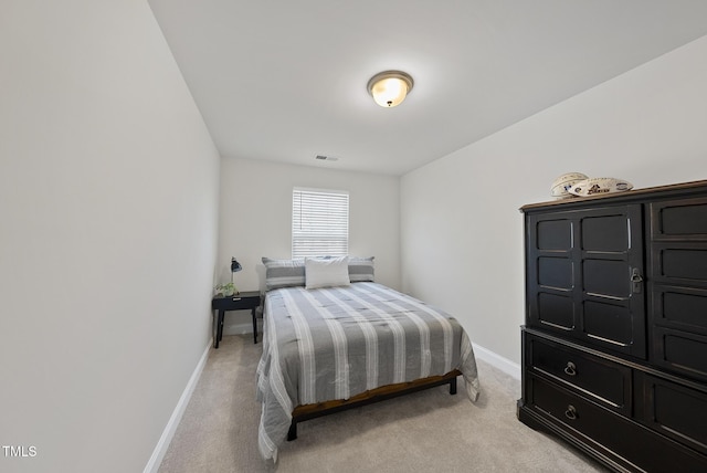bedroom featuring light colored carpet, baseboards, and visible vents