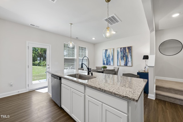 kitchen with visible vents, stainless steel dishwasher, light stone countertops, dark wood finished floors, and a sink