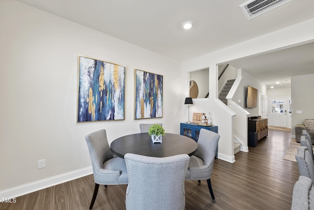 dining room featuring recessed lighting, baseboards, dark wood-type flooring, visible vents, and stairway