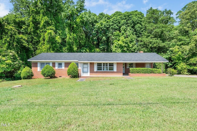 ranch-style house with brick siding and a front yard