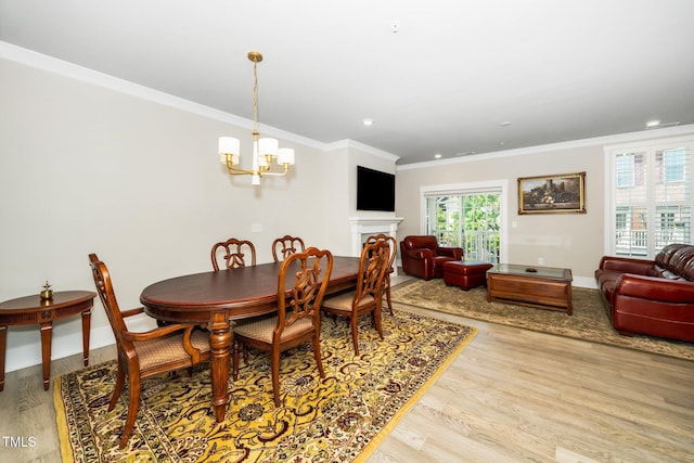 dining area with crown molding, a chandelier, recessed lighting, baseboards, and wood finished floors