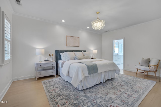 bedroom with visible vents, crown molding, light wood-style floors, baseboards, and a notable chandelier