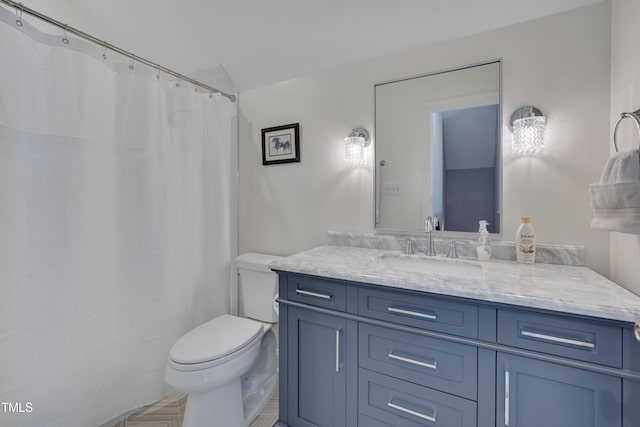 full bathroom with toilet and vanity