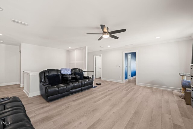 6633 Penfield St, Wake Forest, NC 27587 - living room featuring a ceiling fan, light wood-style flooring, baseboards, recessed lighting, and crown molding