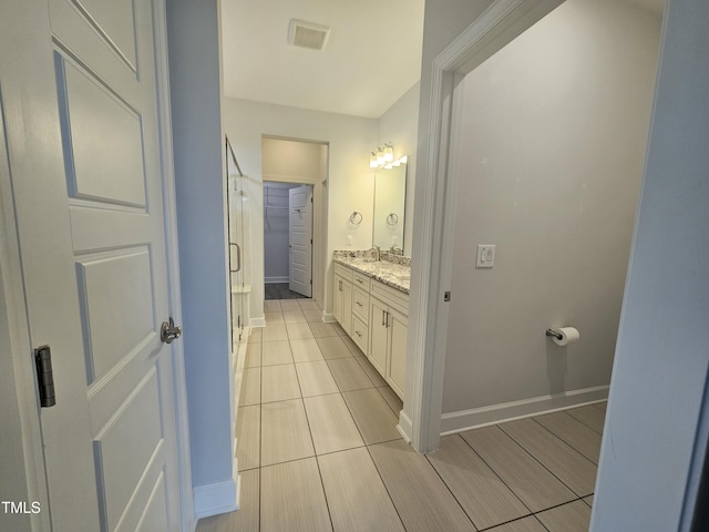 6633 Penfield St, Wake Forest, NC 27587 - full bathroom with vanity, baseboards, a shower stall, and tile patterned floors