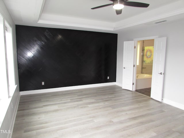 6633 Penfield St, Wake Forest, NC 27587 - spare room featuring a ceiling fan, baseboards, wood finished floors, and a tray ceiling