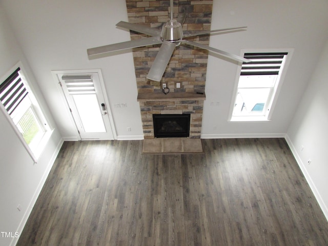 6633 Penfield St, Wake Forest, NC 27587 - unfurnished living room with a ceiling fan, wood finished floors, baseboards, and healthy amount of natural light