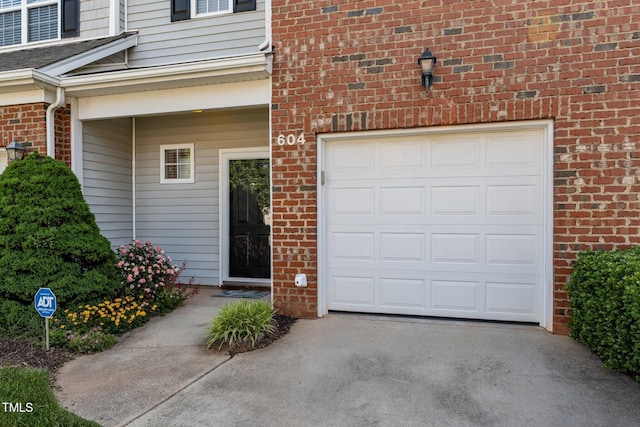 604 Oakfield Trl, Mebane, NC 27302 - garage featuring concrete driveway