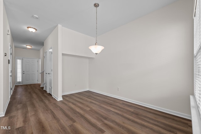 604 Oakfield Trl, Mebane, NC 27302 - unfurnished dining area featuring baseboards and dark wood-style floors