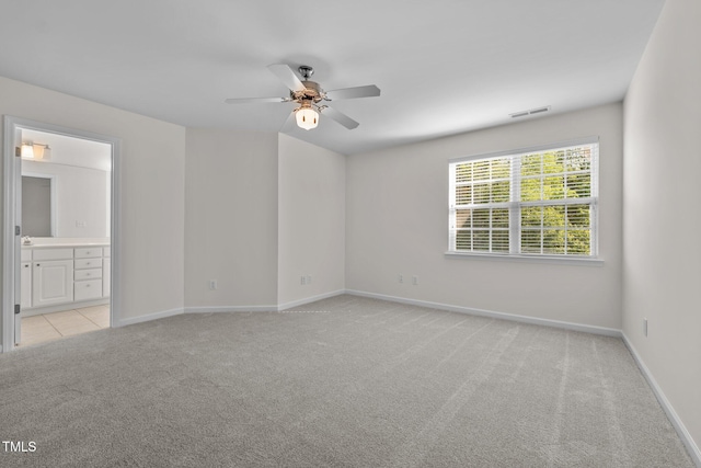 604 Oakfield Trl, Mebane, NC 27302 - spare room with baseboards, visible vents, a ceiling fan, and light colored carpet