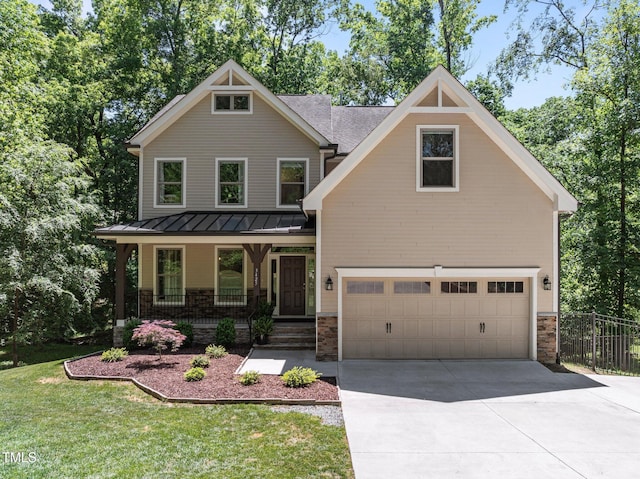 craftsman-style house featuring fence, an attached garage, concrete driveway, a standing seam roof, and covered porch