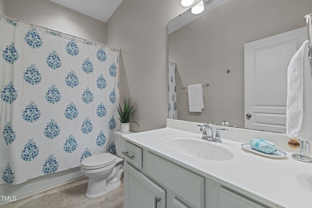 bathroom featuring vanity, tile patterned floors, toilet, and curtained shower
