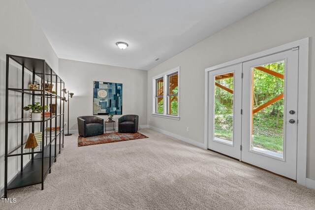 unfurnished room featuring carpet flooring and baseboards