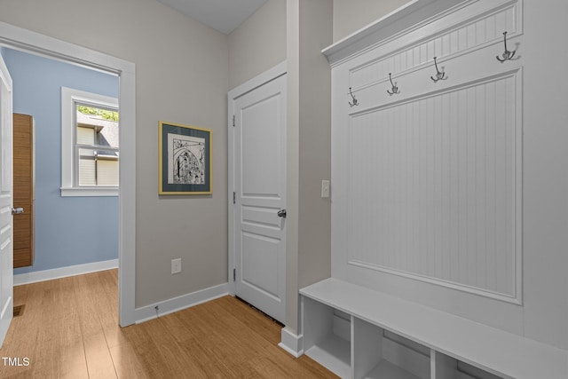 mudroom featuring baseboards and light wood-style flooring