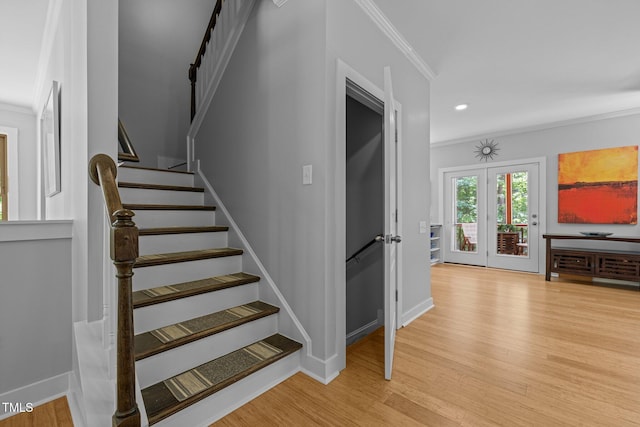 stairway with crown molding, baseboards, recessed lighting, and wood finished floors