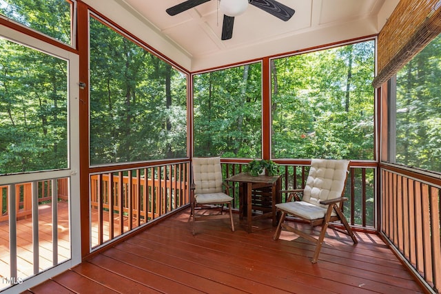 sunroom / solarium featuring ceiling fan