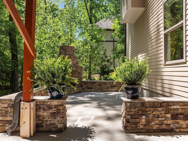 view of patio / terrace with an outdoor stone fireplace