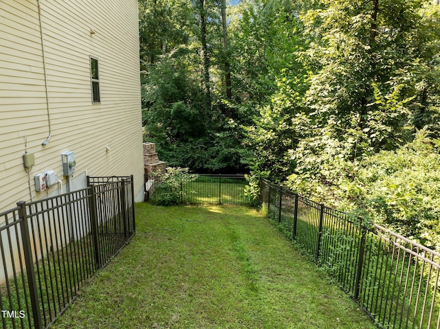 view of yard with a fenced backyard