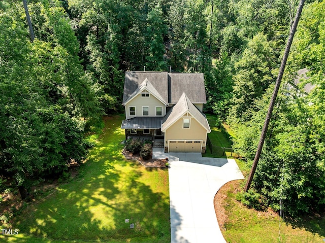 drone / aerial view featuring a forest view