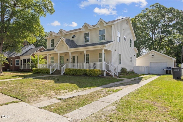 view of front facade featuring a garage, an outdoor structure, a porch, and a front yard