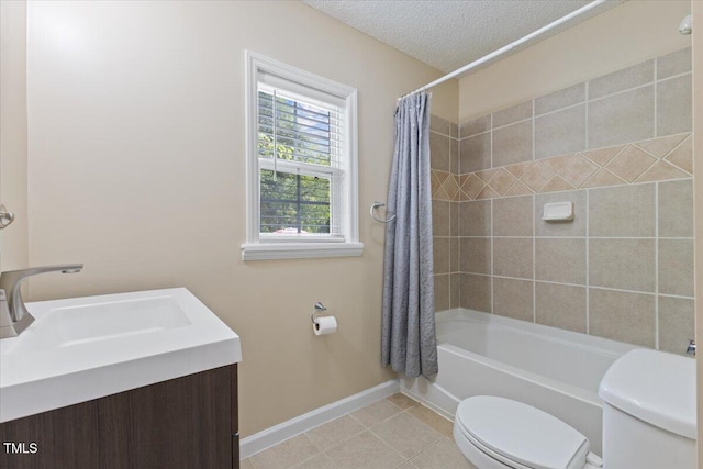 full bathroom with a sink, tile patterned flooring, toilet, shower / bath combo with shower curtain, and baseboards