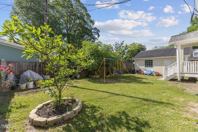 view of yard featuring a fenced backyard and a playground