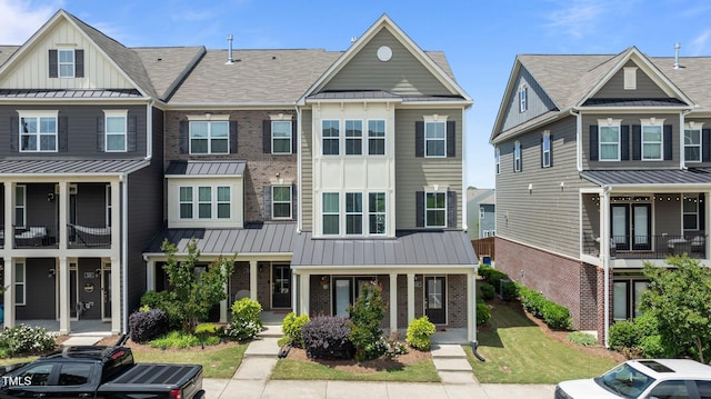 520 Austin View Blvd, Wake Forest, NC 27587 - multi unit property with brick siding, a standing seam roof, board and batten siding, and metal roof
