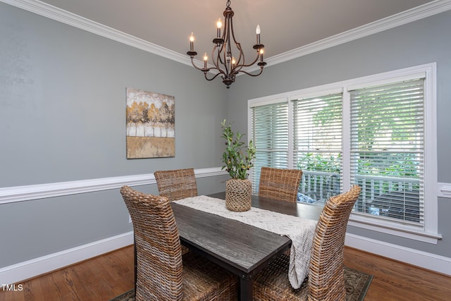 dining area featuring an inviting chandelier, wood finished floors, and a healthy amount of sunlight