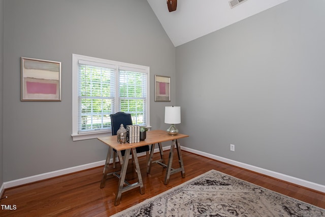 office area with baseboards, ceiling fan, high vaulted ceiling, and wood finished floors