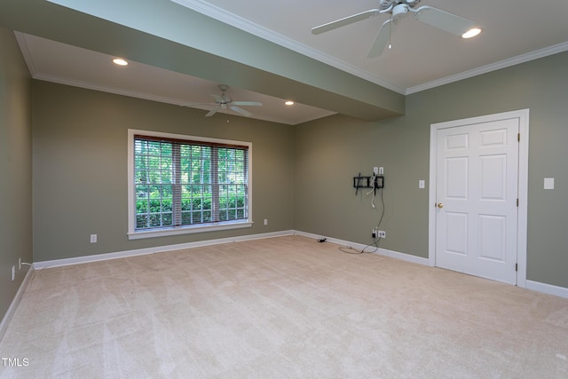 empty room featuring a ceiling fan and light carpet