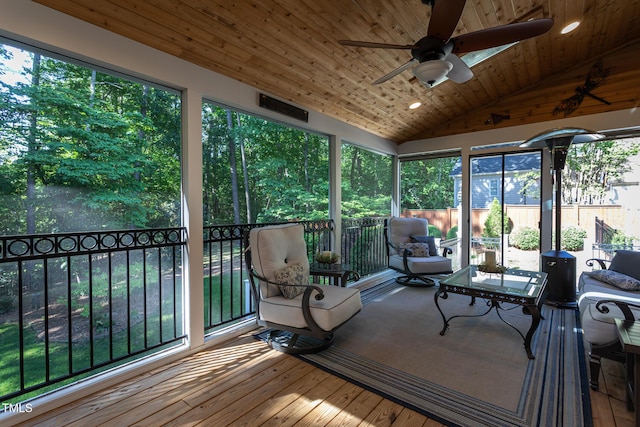 sunroom featuring visible vents and ceiling fan