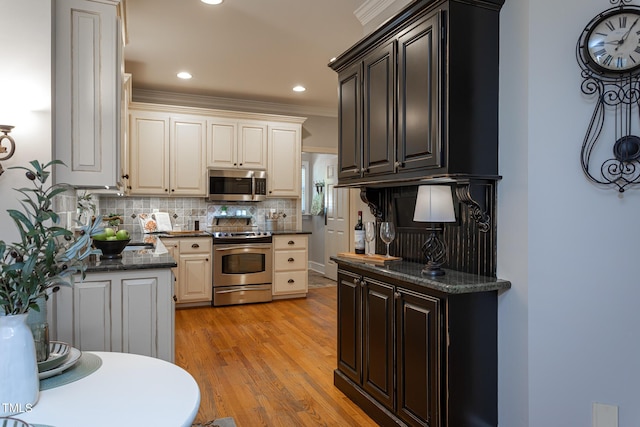 kitchen with decorative backsplash, ornamental molding, light wood-type flooring, recessed lighting, and appliances with stainless steel finishes