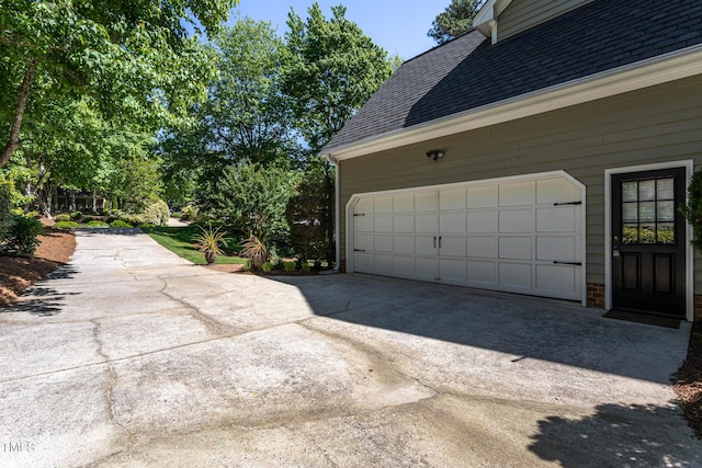 garage with concrete driveway